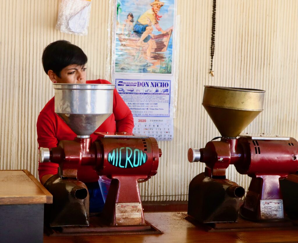 Woman grinding coffee