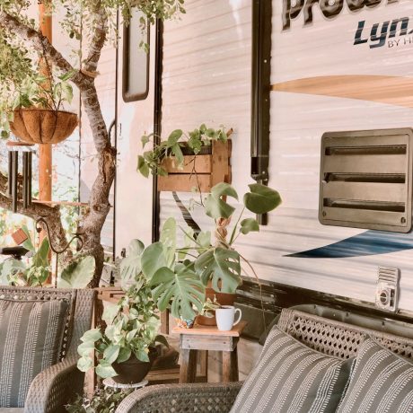 Seating and plants outside of RV